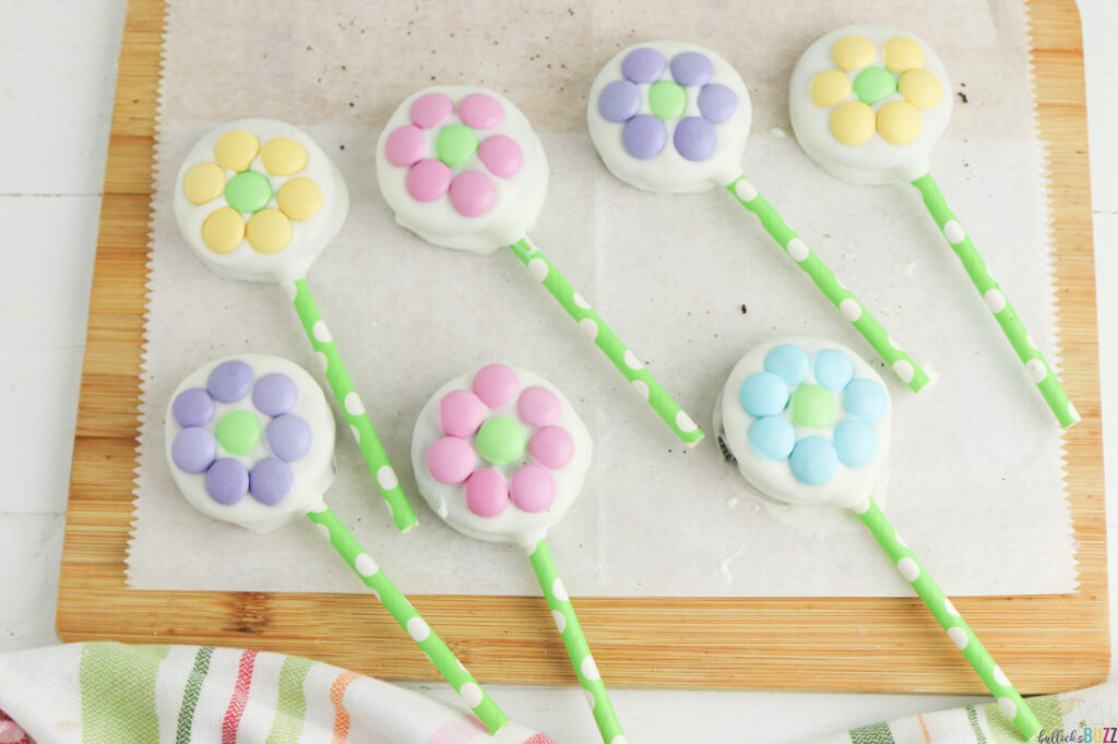 Pastel M&Ms pressed onto the white chocolate-dipped Oreos to look like flowers