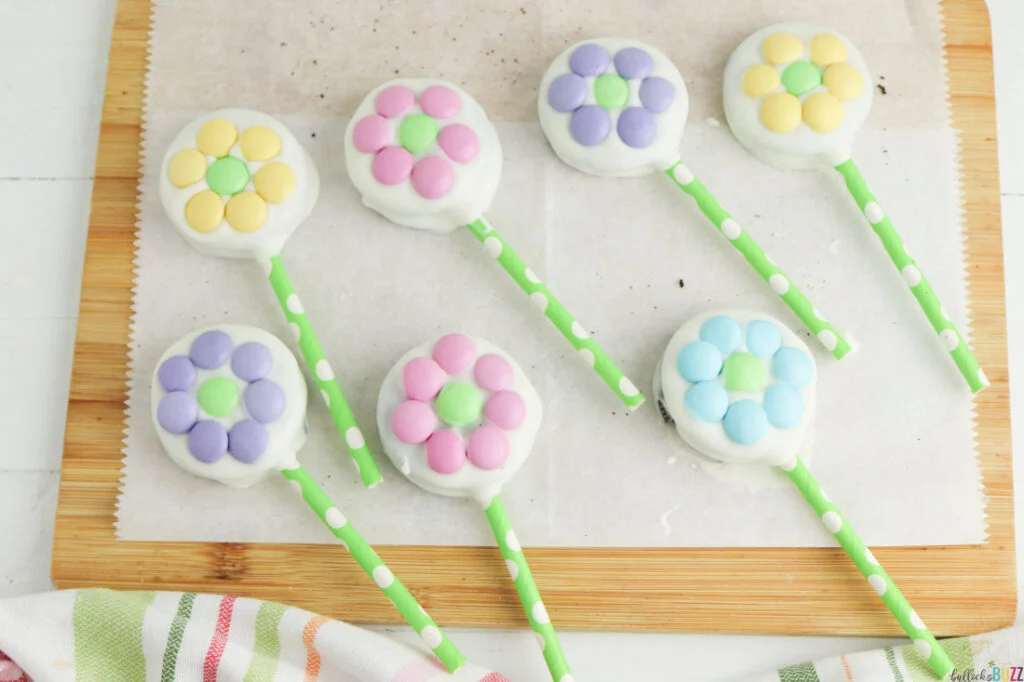 Pastel M&Ms pressed onto the white chocolate-dipped Oreos to look like flowers