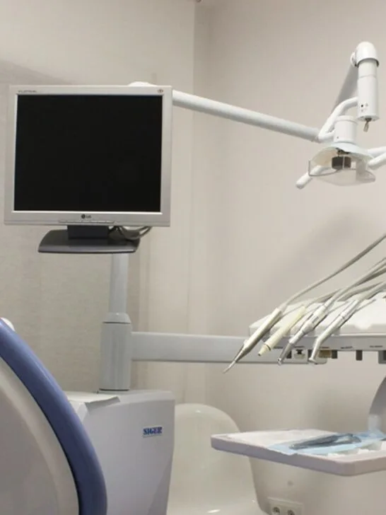 A modern dental care set up including monitor, chair. and tools