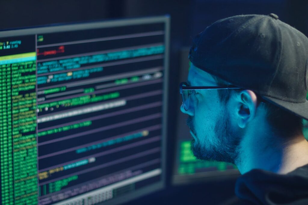 A person looking at html on a computer