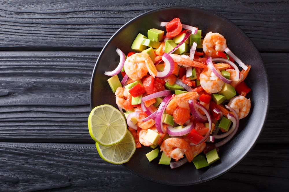 Delicious ceviche of shrimp with vegetables, spices and lime 