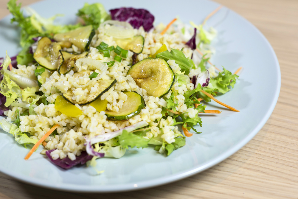 Pearl barley salad with zucchini and colorful vegetables