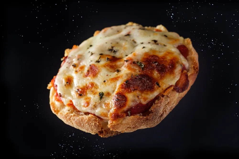 Fresh Baked Homemade English Muffin Pizzas Flying Air — Stock Photo, Image
