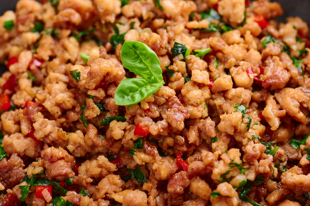 Pad Krapow Gai - Thai Basil Chicken close up. Pad Krapow is Thai cuisine dish with minced chicken or pork meat, basil, soy and oyster sauces. Thai Food