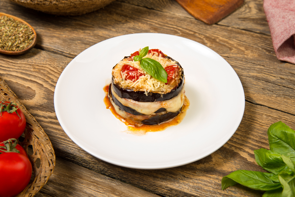 Baked eggplant and tomatoes mozzarella and parmesan stack
