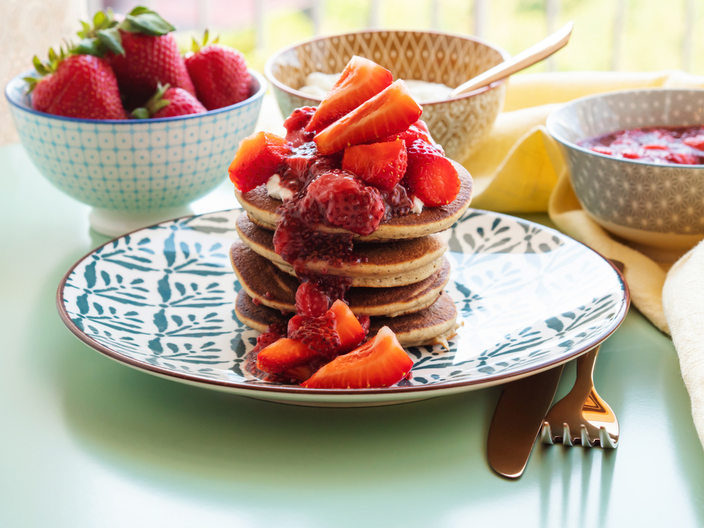 Vegan gluten free banana buckwheat pancakes served with dairy free yogurt and chia strawberry jam — Stock Photo, Image
