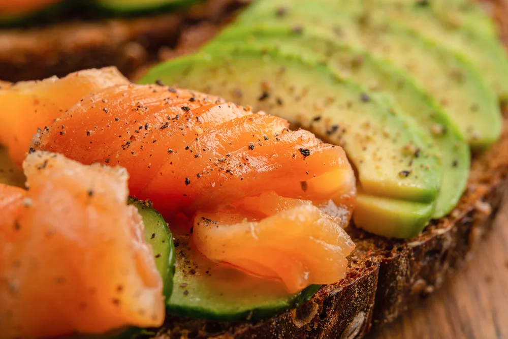 Close Avocado Toast Smoked Salmon Cucumbers — Stock Photo, Image
