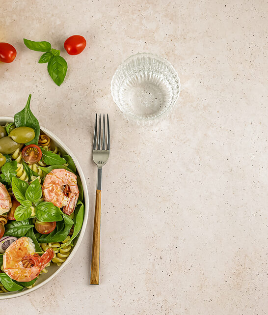 Pasta or noodle salad from wheat and lentils fusilli with avocad