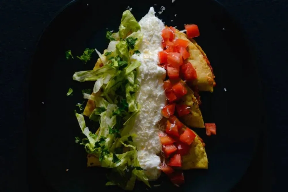 Mashed potato and chorizo fried tacos dorados with lettuce,