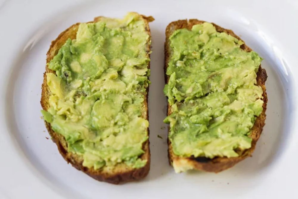 Mashed avocada and whole grain bread healthy toastes
