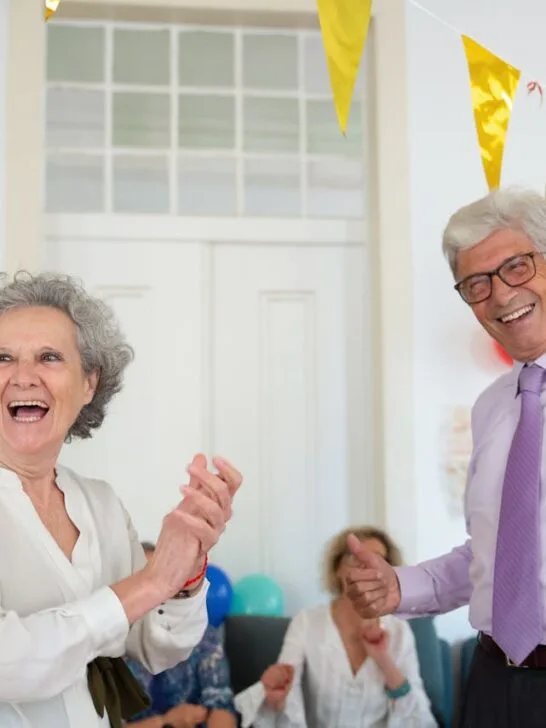 A man and woman celebrating his retirement at a party. Use these tips on funding your dream retirement lifestyle.