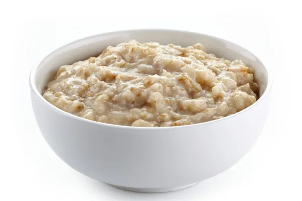 Bowl of oats porridge — Stock Photo, Image