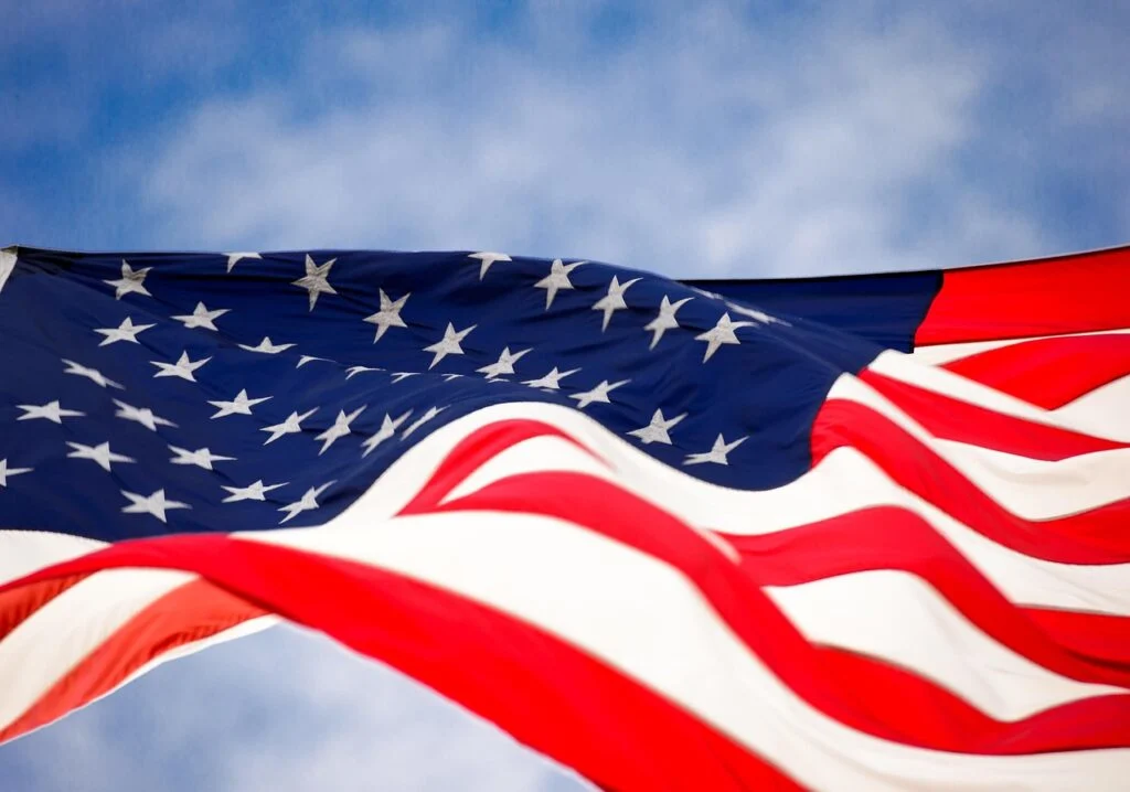 A close up image of an American flag waving in the breeze