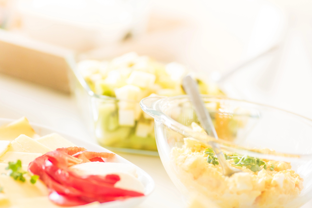 Breakfast table - butter, egg and mayo sandwich filling, sliced — Stock Photo, Image"