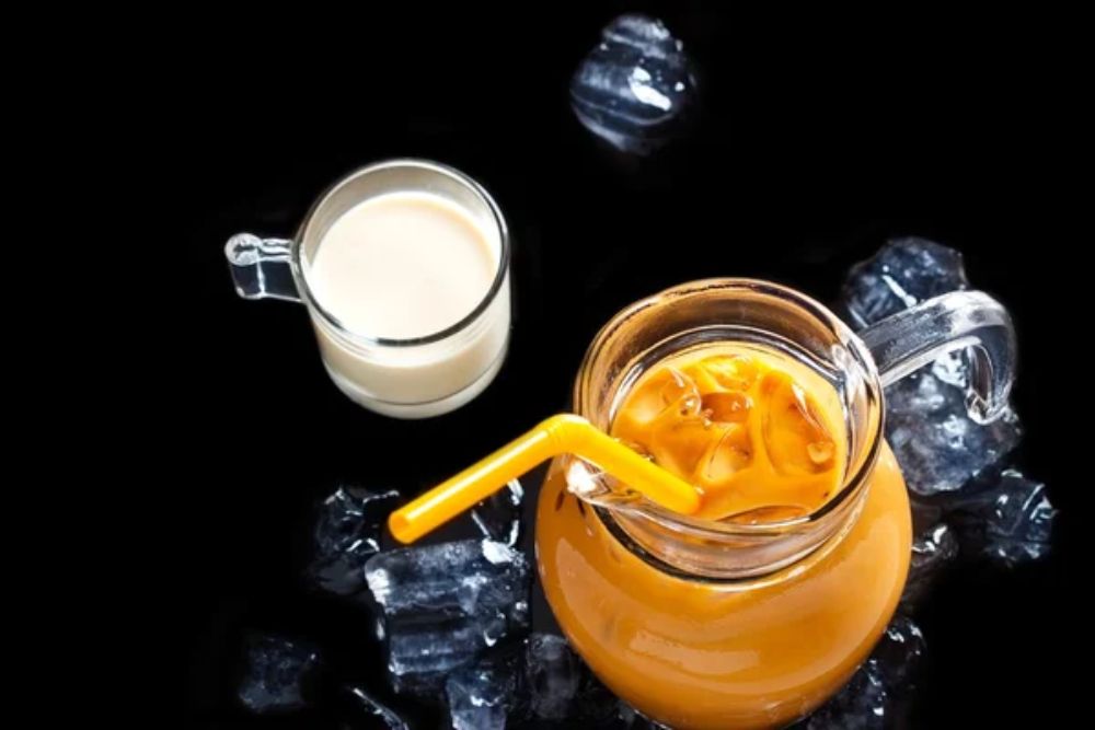Remove BG
Save
Share
Sample
Thai ice tea in glass jar with milk and ice on black background