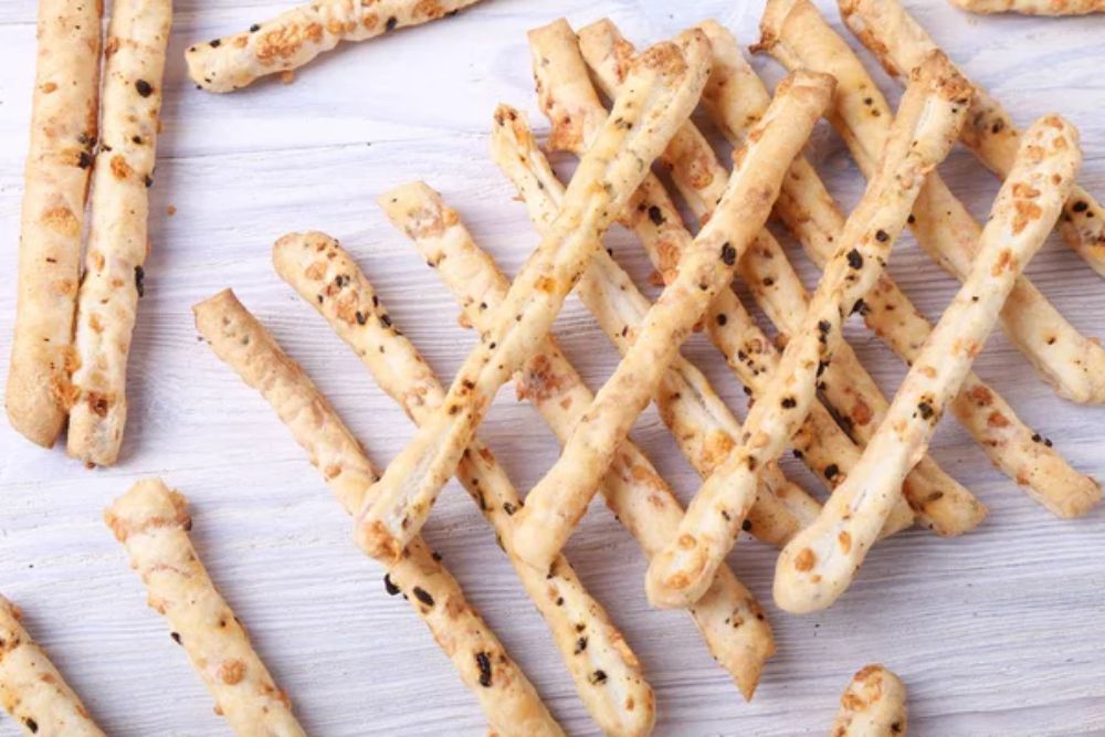 Breadsticks on wooden background. Top view — Photo