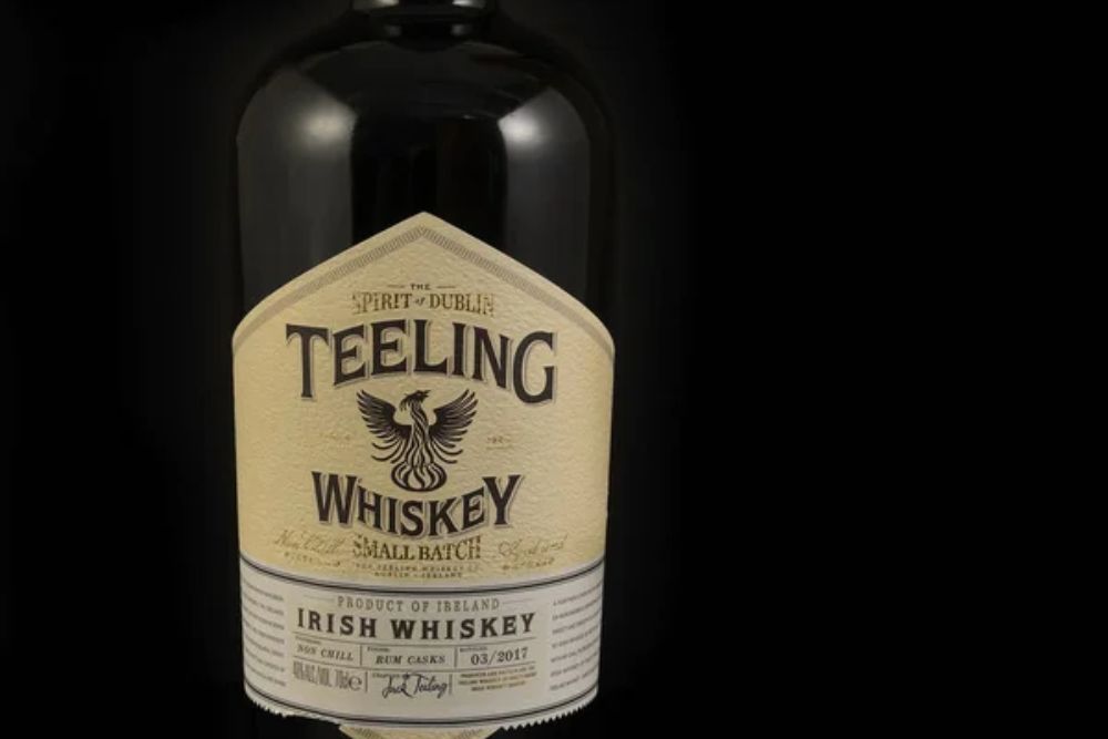 Bottle of Irish Whiskey Teeling, Irish whiskey on black background. Unique Irish whiskey produced in small batches - illustrative editorial — Photo by Pecold