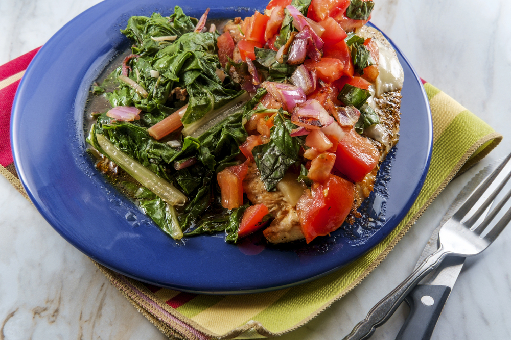Italian Baked Bruschetta Chicken Served Sauteed Garlic Swiss Chard — Stock Photo, Image