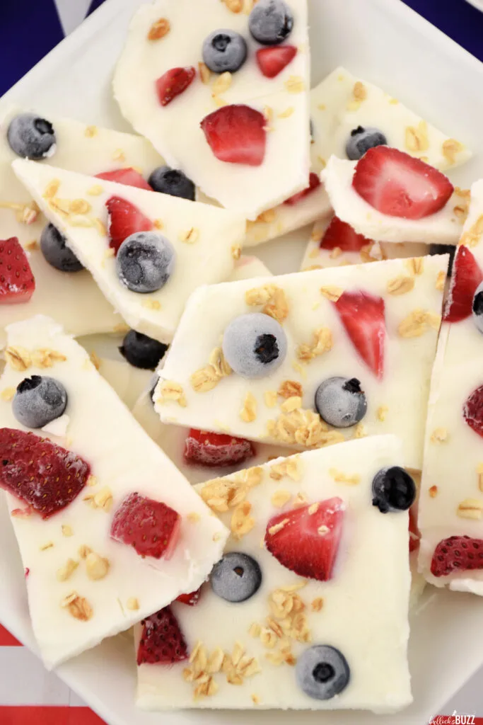 close up of finished 4th of July Frozen Yogurt Bark made with vanilla Greek yogurt, strawberries, blueberries, and granola