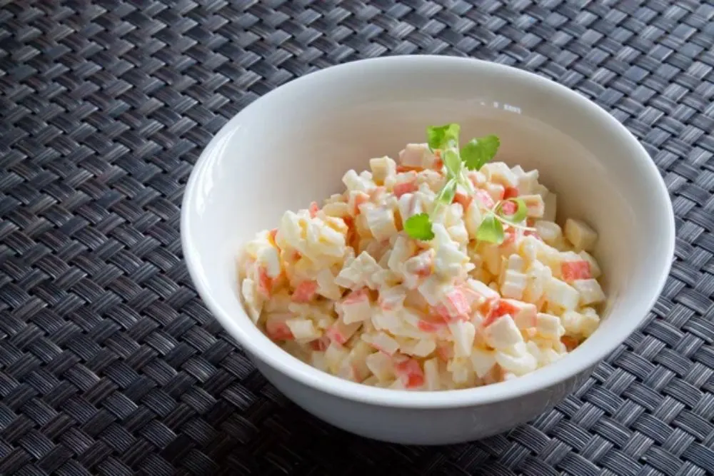 Crab salad with mayonnaise on table — Photo