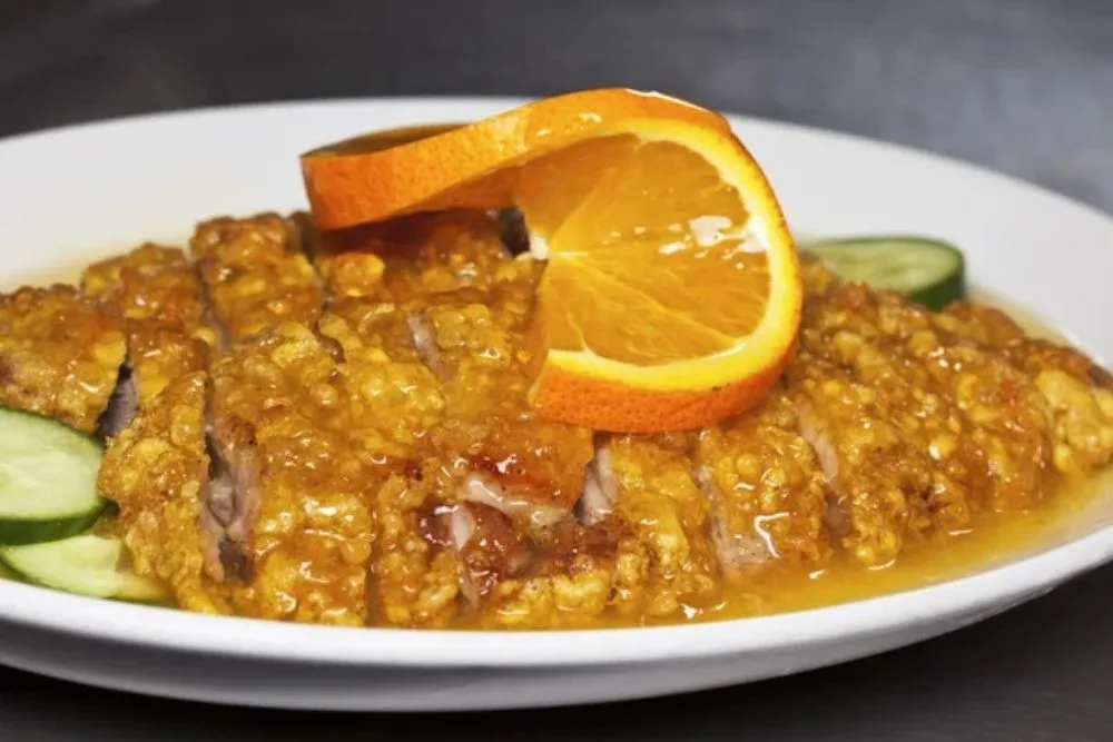 Close-up of chinese orange duck dish — Photo