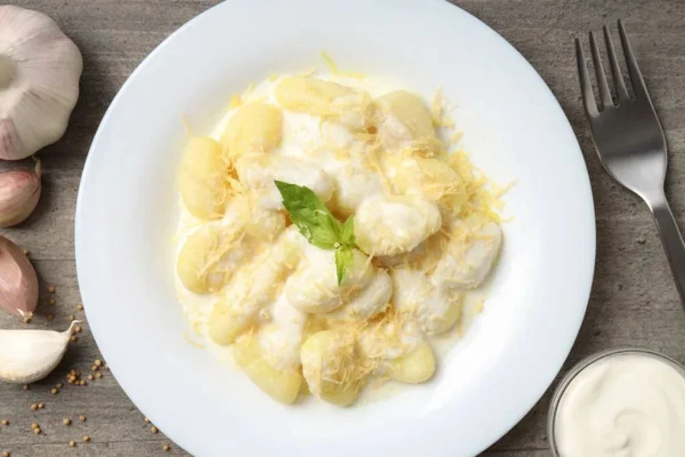 Concept of tasty food with potato gnocchi, top view — Photo