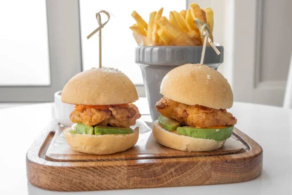 Chicken Sliders with french fries and mayo dip served in a dish 
