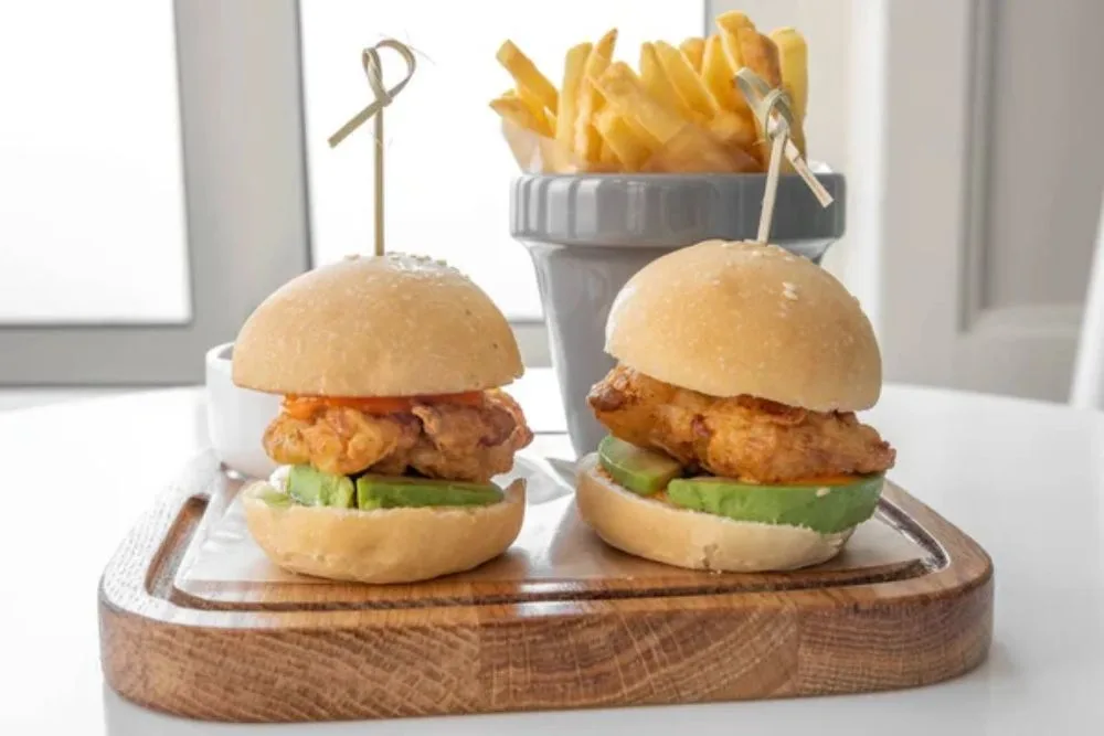 Chicken Sliders with french fries and mayo dip served in a dish