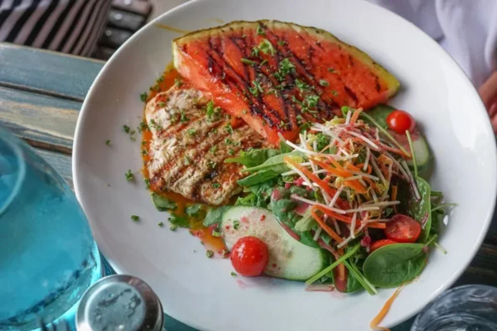 Grilled chicken and watermelon with salad — Photo