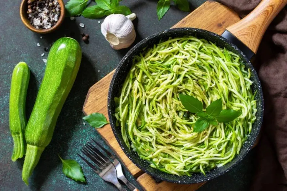 Healthy vegan food, low carb dish. Cooked zucchini noodles