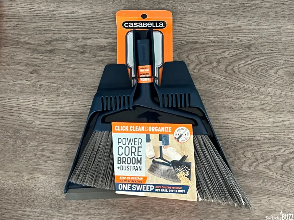 The Casabella Click Clean and Organize Power Core Brom and Dustpan still in its packaging on a grey background