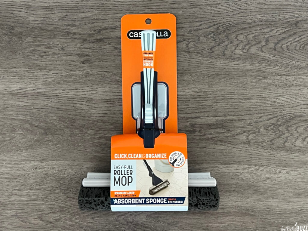 The Casabella Easy-Pull Roller Mop still in its packaging on a grey background
