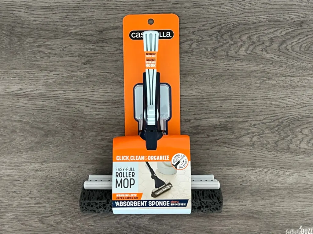 The Casabella Easy-Pull Roller Mop still in its packaging on a grey background