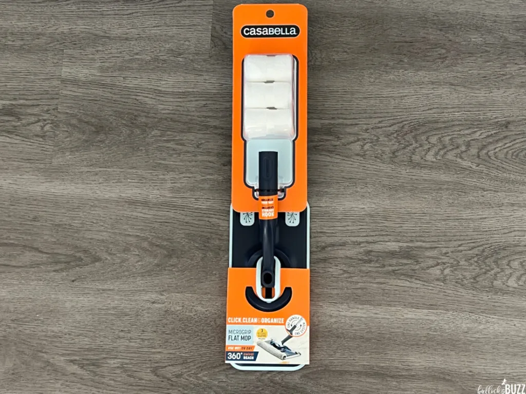 Close up of the Casabella Microgrip Flat Mop still in its packaging on a grey background