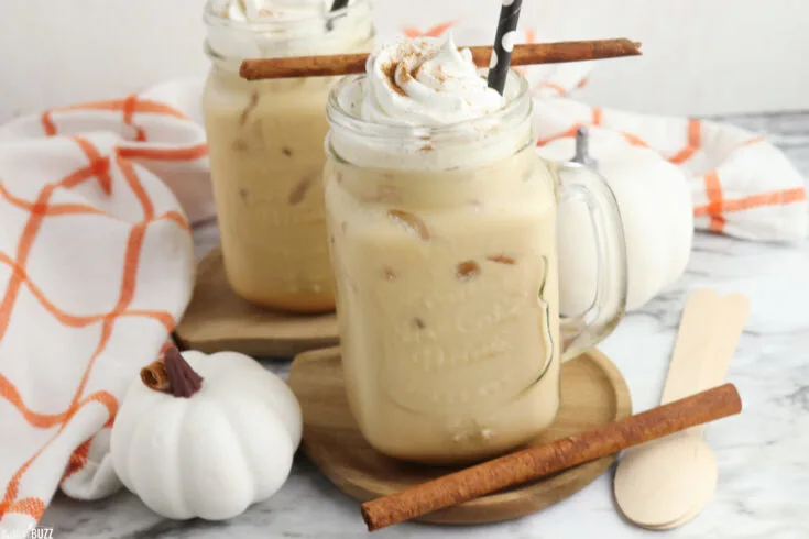 Finished Copycat Starbucks pumpkin Cold Cream Brew in a mason jar topped with whipped cream and a sprinkle of pumpkin pie spice.