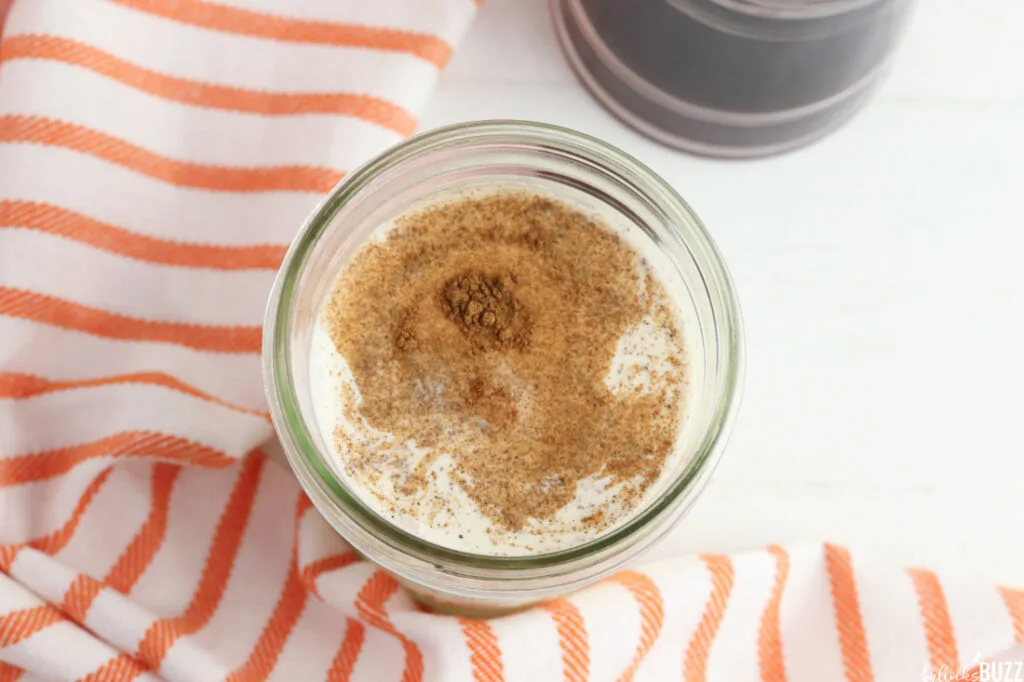 Heavy cream, milk, pumpkin pur&eacute;e, vanilla syrup, and pumpkin pie spice in a jar