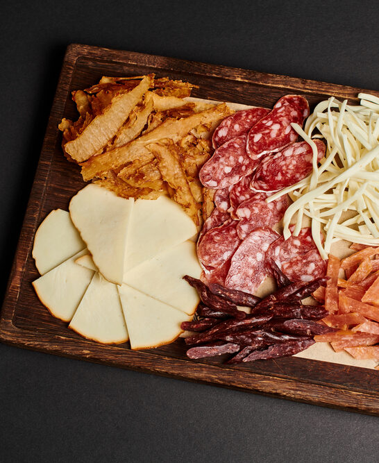 Top View Charcuterie Board Gourmet Cheese Selection Dried Beef Salami — Stock Photo, Image