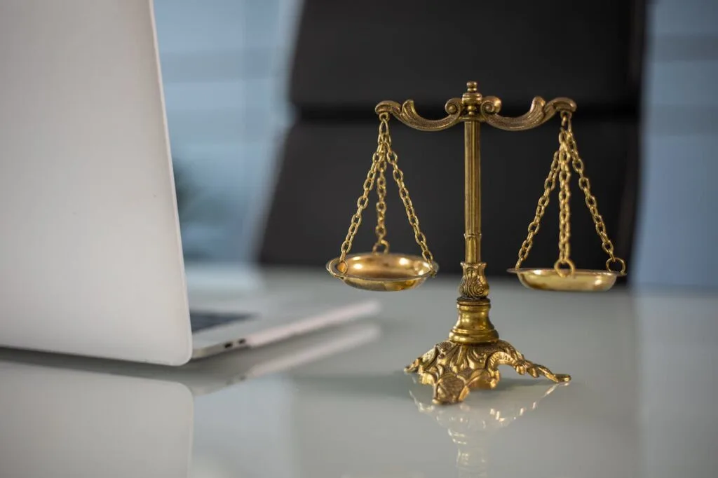 Scales of justice on a desk symbolizing understanding your legal rights and fairness in the law

