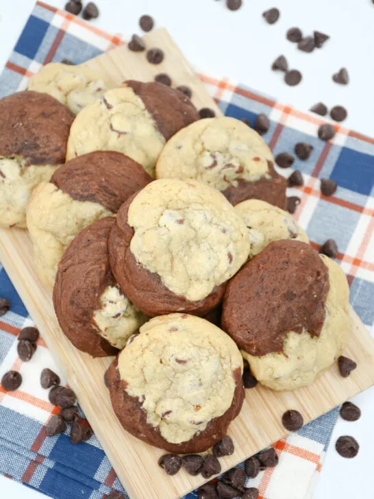 Overhead image of finished cookies on a board surrounded with chocolate chips
