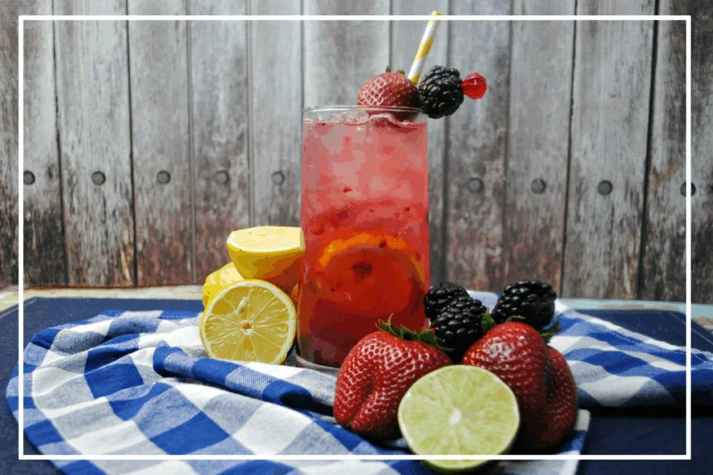 A favorite summer cocktail, this tall glass of Berry Smash Lemonade is refreshingly delicious!