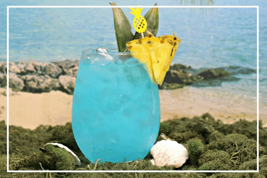 A Blue Hawaiian Cocktail garnished with pineapple is one of the most  classic summer cocktails of all time.