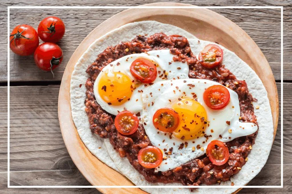 Huevos Rancheros on a stoneware plate, one of the most popular Mexican breakfast ideas