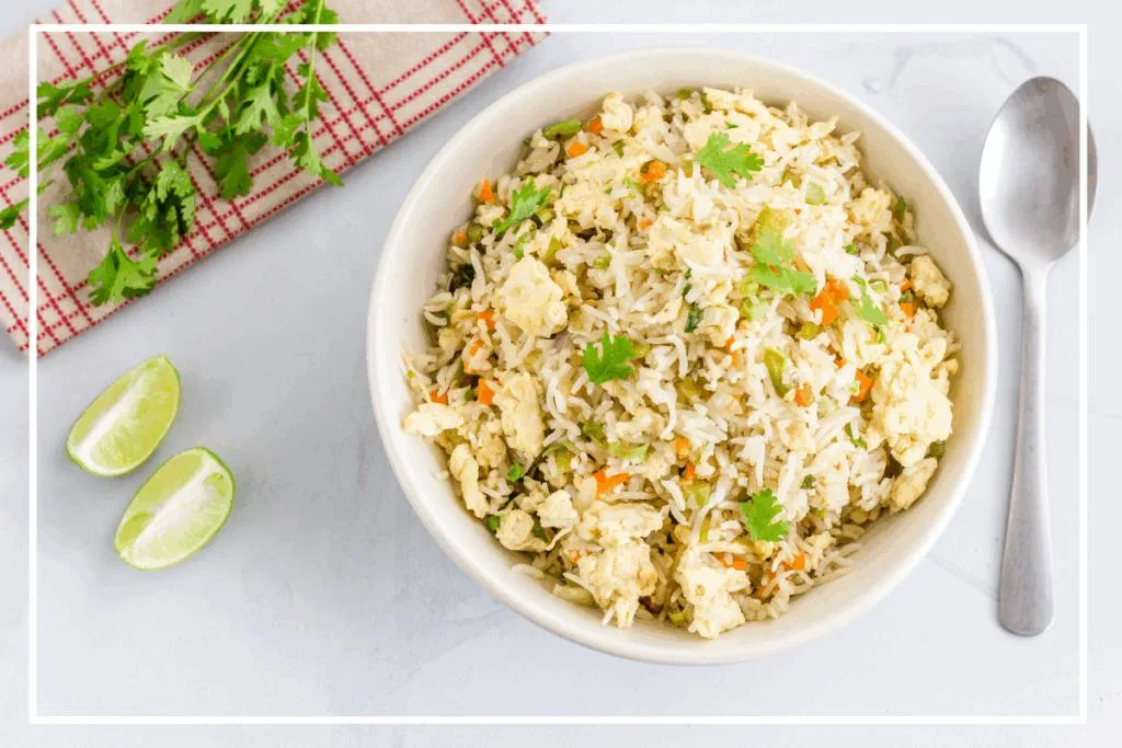 A bowl of Cauliflower Fried Rice on a white background