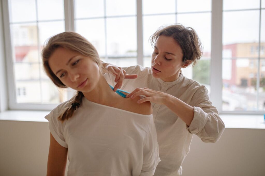 a woman being treated for shoulder pain