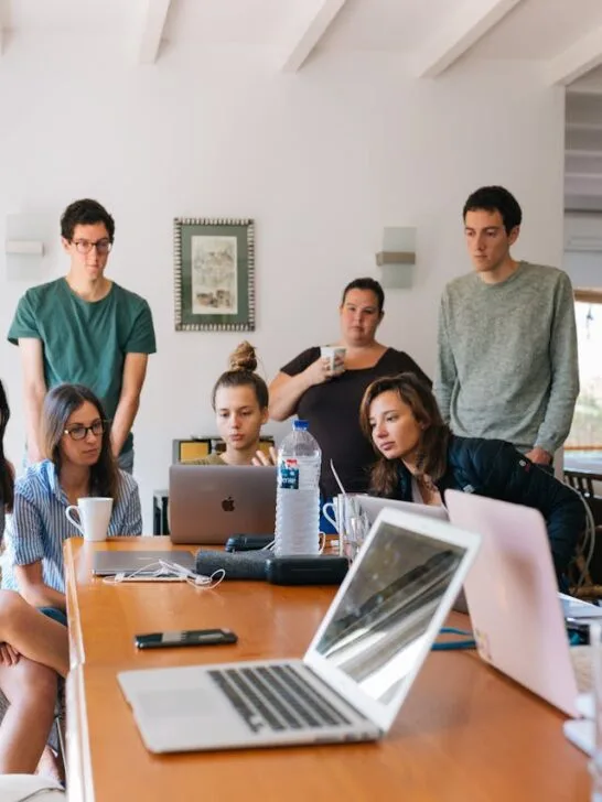 Small business team meeting to discuss planning and small business risk management strategies.