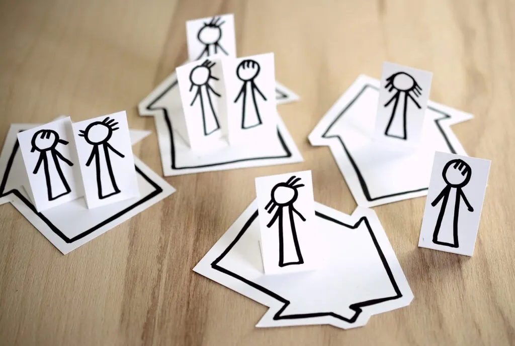 Paper arrows with paper people on them
