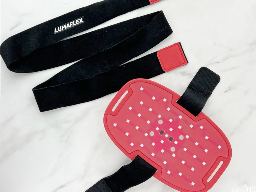 Lumaflex Essential wearable red light therapy wrap with adjustable straps displayed on white background