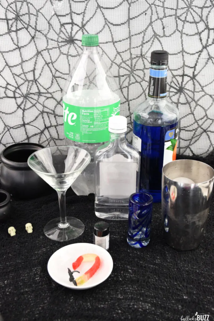 ingredients to make this Halloween cocktail laid out on a table