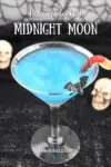 Close up picture of a sparkling blue Midnight Moon Halloween Cocktail with bat and gummy worm garnishes