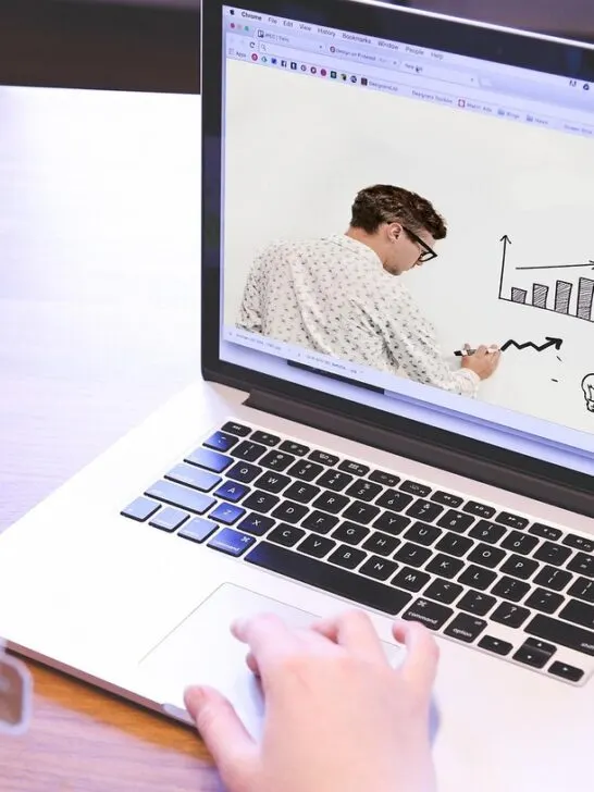 Student learning online with charts and diagrams on screen, representing study strategies for online nursing students.